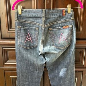 7 for all man kind vintage low rise boot cut size 25 jean with pink A pockets.
